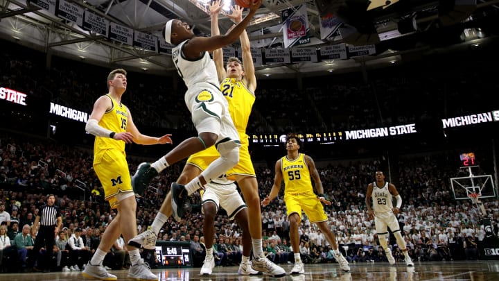 EAST LANSING, MICHIGAN – JANUARY 05: Cassius Winston #5 of the Michigan State Spartans gets to the basket past Franz Wagner #21 of the Michigan Wolverines during the first half at Breslin Center on January 05, 2020 in East Lansing, Michigan. (Photo by Gregory Shamus/Getty Images)