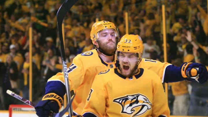 NASHVILLE, TN - APRIL 14: Nashville Predators defenseman Mattias Ekholm (14) embraces Nashville Predators right wing Viktor Arvidsson (33) following Arvidsson's second period goal during Game Two of Round One of the Stanley Cup Playoffs, held on April 14, 2018, at Bridgestone Arena in Nashville, Tennessee. (Photo by Danny Murphy/Icon Sportswire via Getty Images) NASHVILLE, TN - APRIL 14: Nashville Predators defenseman Mattias Ekholm (14) embraces Nashville Predators right wing Viktor Arvidsson (33) following Arvidsson's second period goal during Game Two of Round One of the Stanley Cup Playoffs, held on April 14, 2018, at Bridgestone Arena in Nashville, Tennessee. (Photo by Danny Murphy/Icon Sportswire via Getty Images)