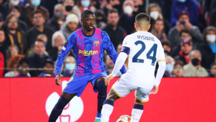 Ousmane Dembele  challenges for the ball against Napoli captain Lorenzo Insigne during their UEFA Europa League match at the Camp Nou on Feb. 17. (Photo by Eric Alonso/Getty Images)