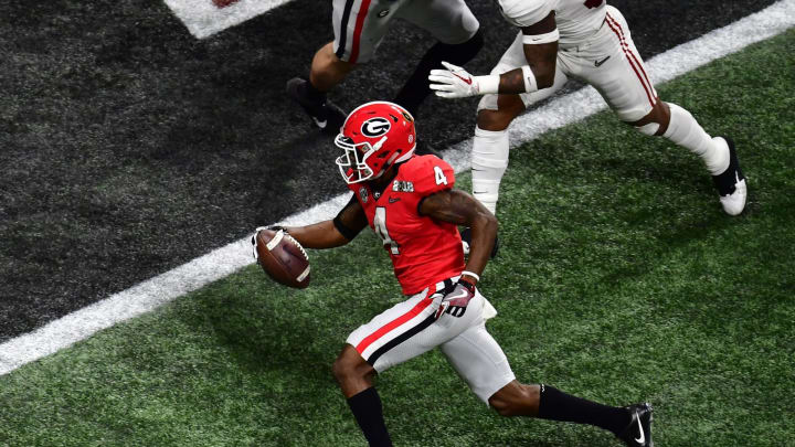 ATLANTA, GA – JANUARY 08: Mecole Hardman #4 of the Georgia Bulldogs carries the ball for a touchdown against the Alabama Crimson Tide in the CFP National Championship presented by AT&T at Mercedes-Benz Stadium on January 8, 2018 in Atlanta, Georgia. (Photo by Scott Cunningham/Getty Images)