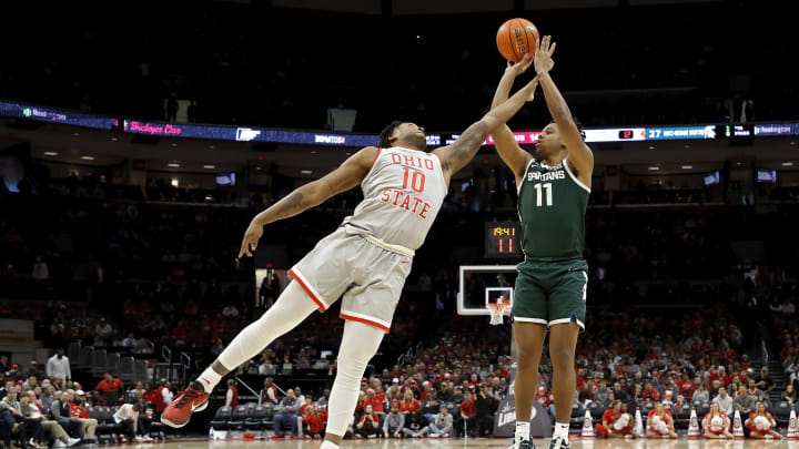 COLUMBUS, OH – FEBRUARY 12: A.J. Hoggard #11 of the Michigan State Spartans shoots the ball over the defense of Brice Sensabaugh #10 of the Ohio State Buckeyes during the second half of the game at the Jerome Schottenstein Center on February 12, 2023 in Columbus, Ohio. Michigan State defeated Ohio State 62-41. (Photo by Kirk Irwin/Getty Images)