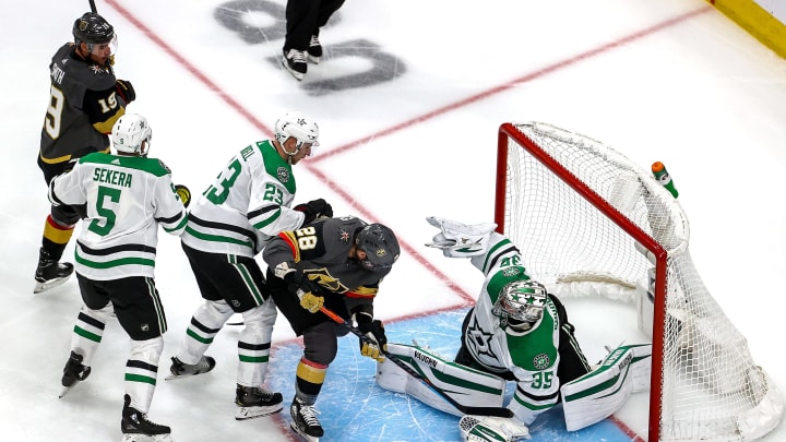 Anton Khudobin #35 of the Dallas Stars makes the save against William Carrier #28 of the Vegas Golden Knights