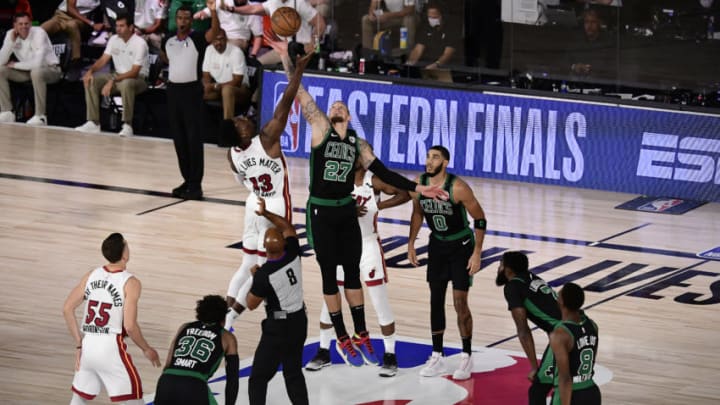 Daniel Theis #27 of the Boston Celtics and Bam Adebayo #13 of the Miami Heat during tip-off in Game One. (Photo by Douglas P. DeFelice/Getty Images)