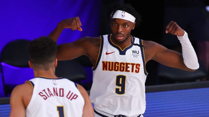 LAKE BUENA VISTA, FLORIDA - AUGUST 06: Jerami Grant #9 of the Denver Nuggets celebrates with Michael Porter Jr. #1 of the Denver Nuggets after a basket and drawing a foul during the third quarter against the Portland Trail Blazers at Visa Athletic Center at ESPN Wide World Of Sports Complex on August 06, 2020 in Lake Buena Vista, Florida. NOTE TO USER: User expressly acknowledges and agrees that, by downloading and or using this photograph, User is consenting to the terms and conditions of the Getty Images License Agreement. (Photo by Kevin C. Cox/Getty Images)