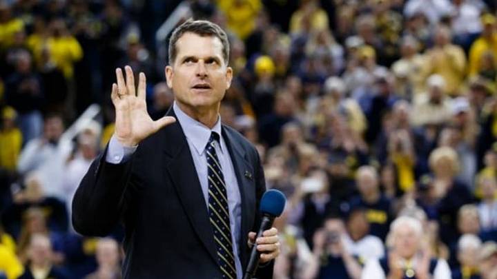 Dec 30, 2014; Ann Arbor, MI, USA; Michigan Wolverines head football coach Jim Harbaugh address the crowd during halftime of the basketball game against the Illinois Fighting Illini at Crisler Center. Mandatory Credit: Rick Osentoski-USA TODAY Sports