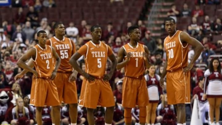 Dec 7, 2013; Philadelphia, PA, USA; Texas Longhorns guard Demarcus Holland (2) guard Cameron Ridley (55) guard Damarcus Croaker (5) guard Isaiah Taylor (1) and forward Jonathan Holmes (10) during the first half against the Temple Owls at the Wells Fargo Center. Texas defeated Temple 81-80 in overtime. Mandatory Credit: Howard Smith-USA TODAY Sports Dec 7, 2013; Philadelphia, PA, USA; Texas Longhorns guard Demarcus Holland (2) guard Cameron Ridley (55) guard Damarcus Croaker (5) guard Isaiah Taylor (1) and forward Jonathan Holmes (10) during the first half against the Temple Owls at the Wells Fargo Center. Texas defeated Temple 81-80 in overtime. Mandatory Credit: Howard Smith-USA TODAY Sports