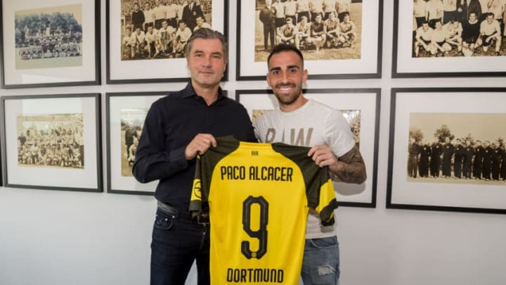 DORTMUND, GERMANY - AUGUST 28: Paco Alcacer signs a new contract with Borussia Dortmund with Michael Zorc (sports director of Borussia Dortmund) at Dortmund on August 28, 2018 in Dortmund, Germany. (Photo by Alexandre Simoes/Borussia Dortmund/Getty Images)