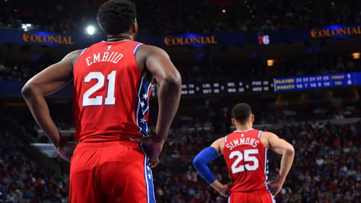 PHILADELPHIA, PA - MARCH 15: Joel Embiid #21 and Ben Simmons #25 of the Philadelphia 76ers look on during a game against the Sacramento Kings on March 15, 2019 at the Wells Fargo Center in Philadelphia, Pennsylvania NOTE TO USER: User expressly acknowledges and agrees that, by downloading and/or using this Photograph, user is consenting to the terms and conditions of the Getty Images License Agreement. Mandatory Copyright Notice: Copyright 2019 NBAE (Photo by Jesse D. Garrabrant/NBAE via Getty Images)