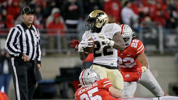 Purdue Boilermakers running back King Doerue (22) is tackled by Ohio State Buckeyes linebacker Tommy Eichenberg (35) and Ohio State Buckeyes linebacker Steele Chambers (22) during the fourth quarter of Saturday's NCAA Division I football game at Ohio Stadium in Columbus, Oh., on November 13, 2021.Osu21pur Bjp 906