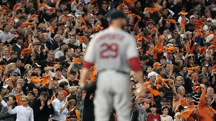 Oct 15, 2012; San Francisco, CA, USA; San Francisco Giants fans celebrate after second baseman Marco Scutaro (not pictured) hit a three-RBI single off of St. Louis Cardinals starting pitcher Chris Carpenter (29) during the fourth inning of game two of the 2012 NLCS at AT