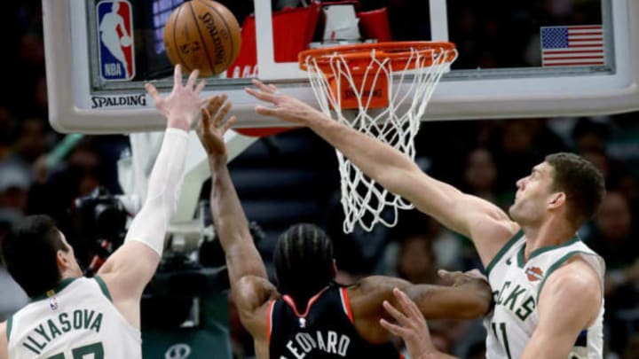 MILWAUKEE, WISCONSIN – MAY 17: Kawhi Leonard #2 of the Toronto Raptors attempts a shot while being guarded by Ersan Ilyasova #77 and Brook Lopez #11 of the Milwaukee Bucks in the fourth quarter during Game Two of the Eastern Conference Finals of the 2019 NBA Playoffs at the Fiserv Forum on May 17, 2019 in Milwaukee, Wisconsin. NOTE TO USER: User expressly acknowledges and agrees that, by downloading and or using this photograph, User is consenting to the terms and conditions of the Getty Images License Agreement. (Photo by Jonathan Daniel/Getty Images)