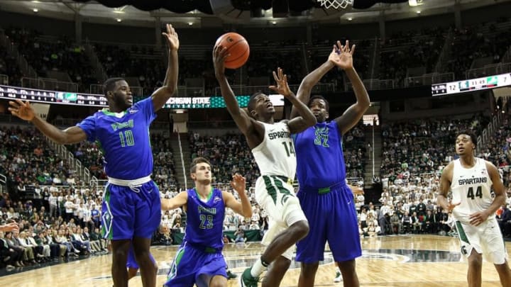 Nov 20, 2016; East Lansing, MI, USA; Michigan State Spartans guard Eron Harris (14) drives to the basket against Florida Gulf Coast Eagles forward Antravious Simmons (32) during the second half of a game at Jack Breslin Student Events Center. Mandatory Credit: Mike Carter-USA TODAY Sports