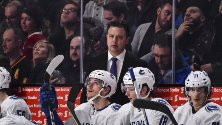 MONTREAL, QC - JANUARY 07: Head coach of the Vancouver Canucks Travis Green looks on against the Montreal Canadiens during the NHL game at the Bell Centre on January 7, 2018 in Montreal, Quebec, Canada. The Montreal Canadiens defeated the Vancouver Canucks 5-2. (Photo by Minas Panagiotakis/Getty Images)
