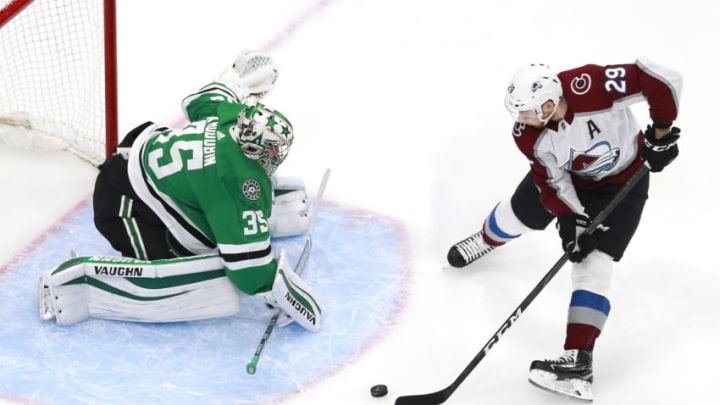 EDMONTON, ALBERTA - AUGUST 05: Nathan MacKinnon #29 of the Colorado Avalanche tries to get the puck past Anton Khudobin #35 of the Dallas Stars in the first period in a Western Conference Round Robin game during the 2020 NHL Stanley Cup Playoff at Rogers Place on August 05, 2020 in Edmonton, Alberta. (Photo by Jeff Vinnick/Getty Images)