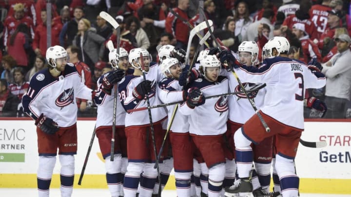 WASHINGTON, DC - JANUARY 12: Artemi Panarin #9 of the Columbus Blue Jackets celebrates with his teammates after scoring the game winning goal in overtime to defeat the Washington Capitals 2-1 at Capital One Arena on January 12, 2019 in Washington, DC. (Photo by Patrick McDermott/NHLI via Getty Images)