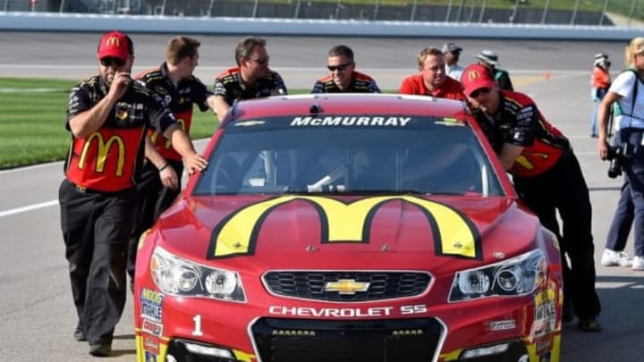 May 6, 2016; Kansas City, KS, USA; Crew members push the car of NASCAR Sprint Cup Series driver Jamie McMurray down pit road before qualifying for the GoBowling 400 at Kansas Speedway. Mandatory Credit: Jasen Vinlove-USA TODAY Sports