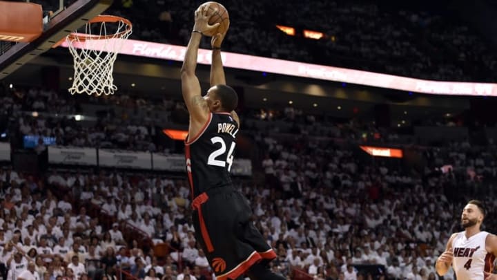 May 9, 2016; Miami, FL, USA; Toronto Raptors guard Norman Powell (24) dunks the ball as Miami Heat forward Josh McRoberts (4) trails during the second quarter in game four of the second round of the NBA Playoffs at American Airlines Arena. Mandatory Credit: Steve Mitchell-USA TODAY Sports