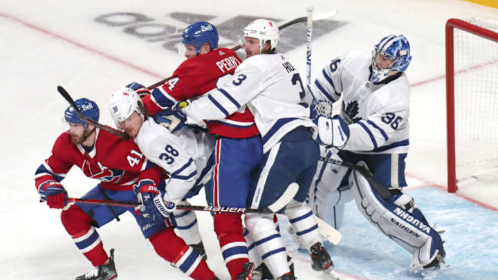 May 24, 2021; Montreal, Quebec, CAN; Toronto Maple Leafs goaltender Jack Campbell (36) and defensemen Rasmus Sandin (38) and Justin Holl (3) in action against right wings Paul Byron (41) and Corey Perry (94) during the third period of the game three of the first round of the 2021 Stanley Cup Playoffs at Bell Centre. Mandatory Credit: Jean-Yves Ahern-USA TODAY Sports