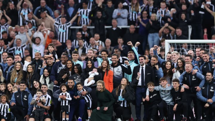 NEWCASTLE UPON TYNE, ENGLAND - MAY 22: Players, staff and families of Newcastle United pose for a photo after their team qualifies for the UEFA Champions League following the Premier League match between Newcastle United and Leicester City at St. James Park on May 22, 2023 in Newcastle upon Tyne, England. (Photo by Alex Livesey/Getty Images)