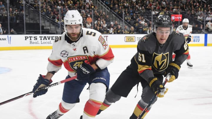 LAS VEGAS, NEVADA - FEBRUARY 28: Aaron Ekblad #5 of the Florida Panthers and Mark Stone #61 of the Vegas Golden Knights chase after the puck in the second period of their game at T-Mobile Arena on February 28, 2019 in Las Vegas, Nevada. The Golden Knights defeated the Panthers 6-5 in a shootout. (Photo by Ethan Miller/Getty Images)