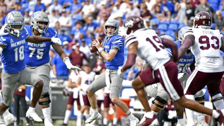 Memphis Tigers quarterback Seth Henigan throws a pass against Mississippi State