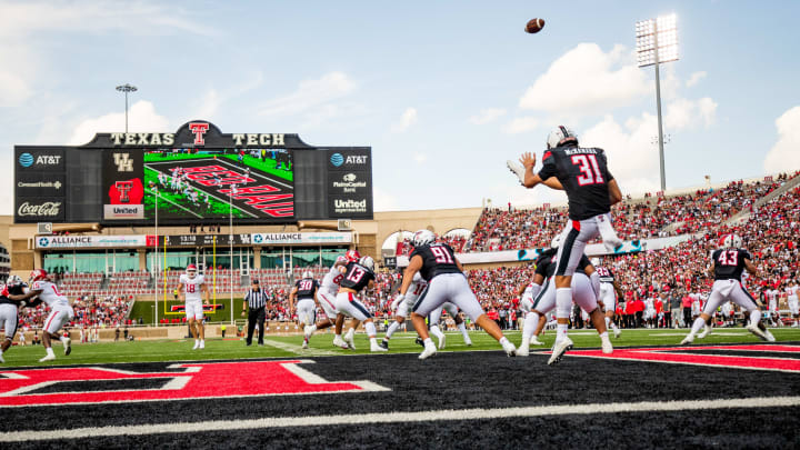 LUBBOCK, TEXAS – SEPTEMBER 10: Punter Austin McNamara #31 of the Texas Tech Red Raiders punts the ball during the first half of the game against the Houston Cougars at Jones AT&T Stadium on September 10, 2022 in Lubbock, Texas. (Photo by John E. Moore III/Getty Images)