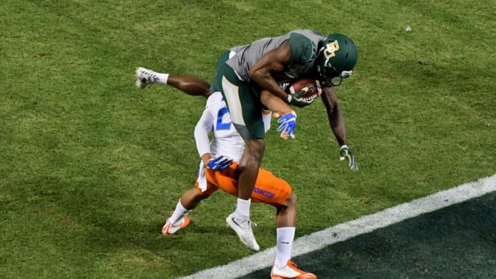 Dec 27, 2016; Phoenix, AZ, USA; Baylor Bears wide receiver KD Cannon (9) catches a pass for a 30 yard touchdown as Boise State Broncos cornerback Jonathan Moxey (2) defends during the first half during the Cactus Bowl at Chase Field. Mandatory Credit: Matt Kartozian-USA TODAY Sports
