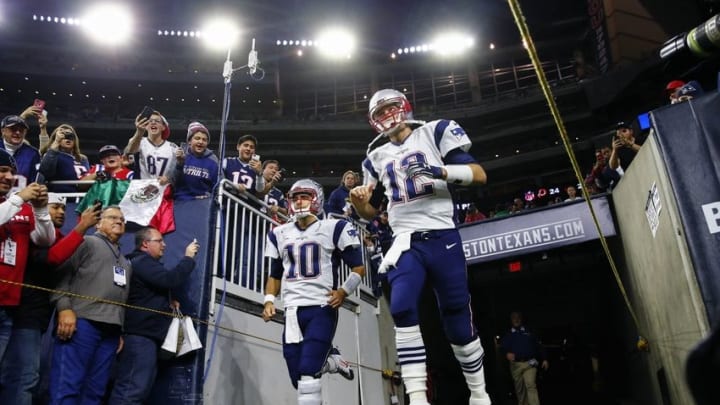 Dec 13, 2015; Houston, TX, USA; New England Patriots quarterback Tom Brady (12) and quarterback Jimmy Garoppolo (10) enter the field before the game against the Houston Texans at NRG Stadium. Mandatory Credit: Kevin Jairaj-USA TODAY Sports