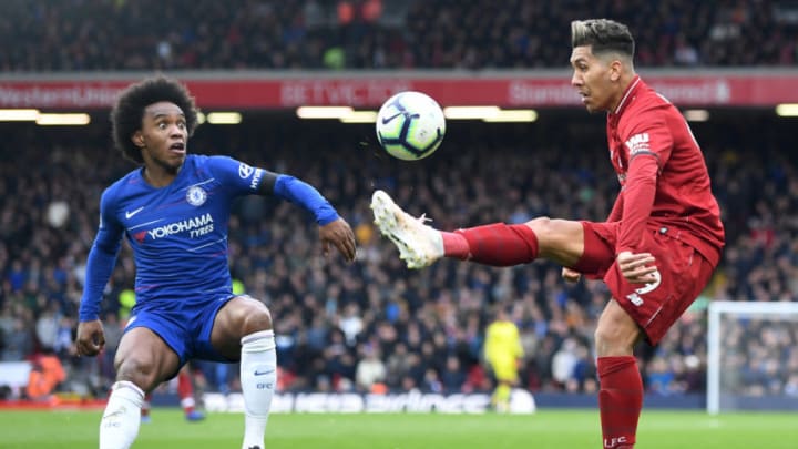 LIVERPOOL, ENGLAND - APRIL 14: Roberto Firmino of Liverpool controls the ball from Willian of Chelsea during the Premier League match between Liverpool FC and Chelsea FC at Anfield on April 14, 2019 in Liverpool, United Kingdom. (Photo by Michael Regan/Getty Images)