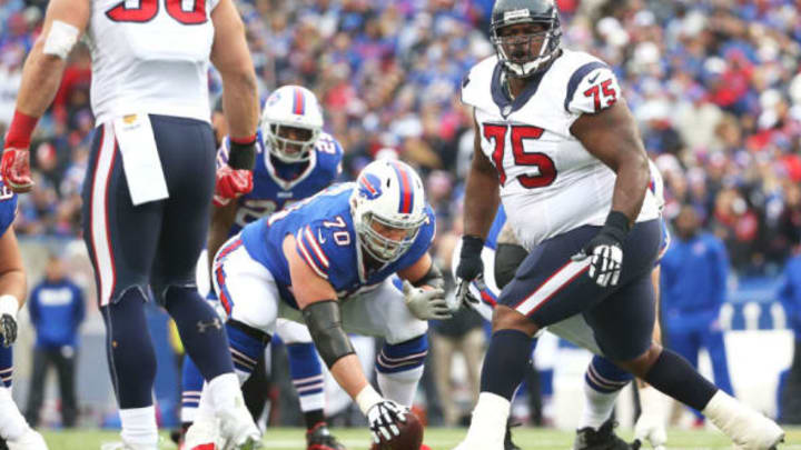 ORCHARD PARK, NY – DECEMBER 06: Eric Wood #70 of the Buffalo Bills gets set to snap the ball as Vince Wilfork #75 of the Houston Texans makes a defensive call during the first half at Ralph Wilson Stadium on December 6, 2015 in Orchard Park, New York. (Photo by Tom Szczerbowski/Getty Images)