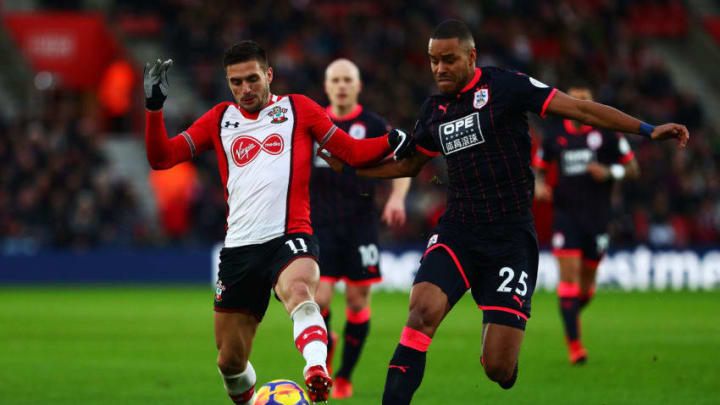 SOUTHAMPTON, ENGLAND – DECEMBER 23: Dusan Tadic of Southampton battles for possesion with Mathias Jorgensen of Huddersfield Town during the Premier League match between Southampton and Huddersfield Town at St Mary’s Stadium on December 23, 2017 in Southampton, England. (Photo by Clive Rose/Getty Images)