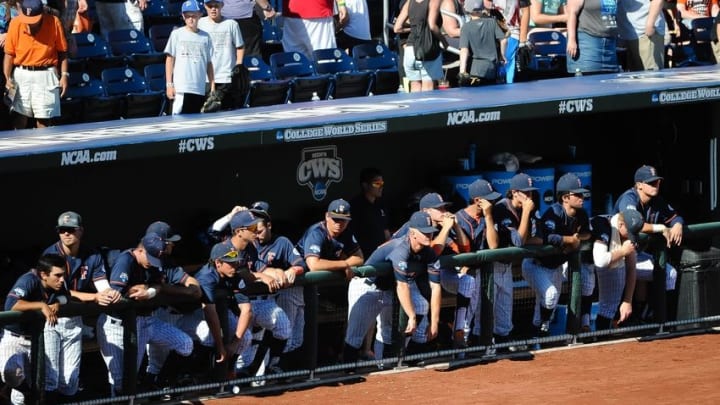 Jun 16, 2015; Omaha, NE, USA; The Cal State Fullerton Titans bench watches the LSU Tigers celebrate after the game in the 2015 College World Series at TD Ameritrade Park. LSU defeated Cal State Fullerton 5-3. Mandatory Credit: Steven Branscombe-USA TODAY Sports