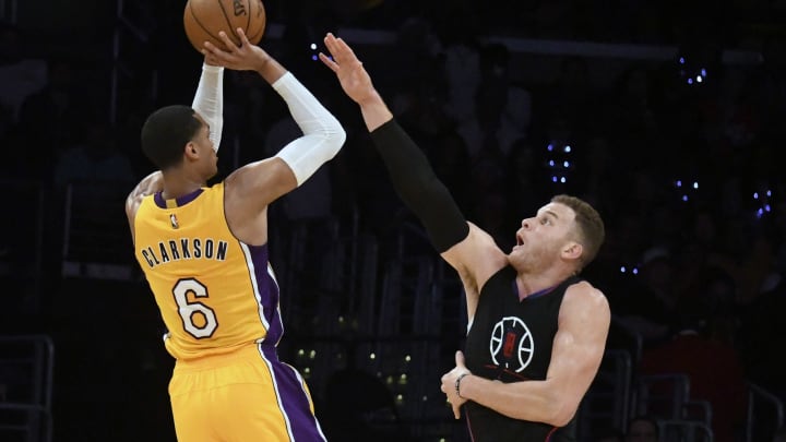 Mar 21, 2017; Los Angeles, CA, USA; Los Angeles Lakers guard Jordan Clarkson (6) shoots against LA Clippers forward Blake Griffin (32) in the first half at Staples Center. Mandatory Credit: Richard Mackson-USA TODAY Sports