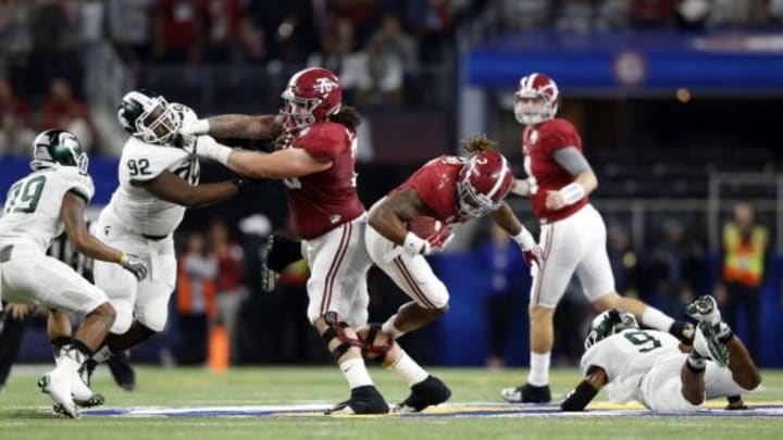 Dec 31, 2015; Arlington, TX, USA; Alabama Crimson Tide running back Derrick Henry (2) is tackled by Michigan State Spartans safety Montae Nicholson (9) in the second quarter in the 2015 CFP semifinal at the Cotton Bowl at AT&T Stadium. Mandatory Credit: Kevin Jairaj-USA TODAY Sports
