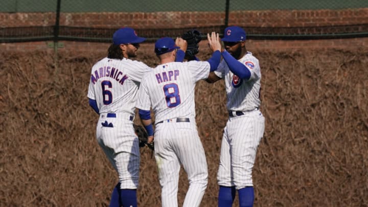 CHICAGO, ILLINOIS - APRIL 04: (L-R) Jake Marisnick #6, Ian Happ #8 and Jason Heyward #22 of the Chicago Cubs celebrate their team's 4-3 win over the Pittsburgh Pirates at Wrigley Field on April 04, 2021 in Chicago, Illinois. (Photo by Nuccio DiNuzzo/Getty Images)