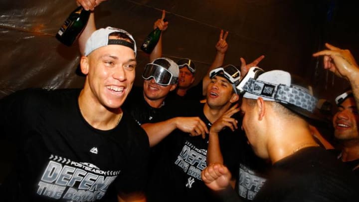 NEW YORK, NY - SEPTEMBER 22: Aaron Judge #99, Luke Voit #45 and Gary Sanchez #24 of the New York Yankees celebrates clinching a playoff spot after defeating the Baltimore Orioles 3-2 in eleventh inning at Yankee Stadium on September 22, 2018 in the Bronx borough of New York City. (Photo by Mike Stobe/Getty Images)