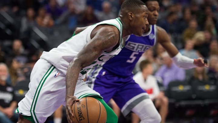 Boston Celtics guard Terry Rozier (12) drives past Sacramento Kings guard De'Aaron Fox (5) in the fourth quarter on Sunday, March 25, 2018 at Golden 1 Center in Sacramento, Calif. (Paul Kitagaki Jr./Sacramento Bee/TNS via Getty Images)