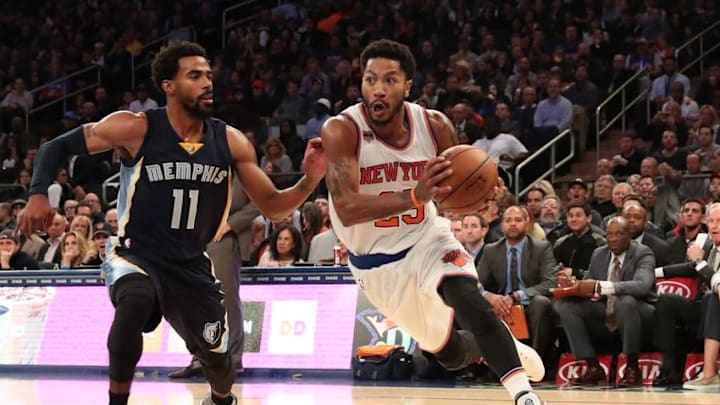 Oct 29, 2016; New York, NY, USA; New York Knicks guard Derrick Rose (25) dribbles the ball past Memphis Grizzlies guard Mike Conley (11) during the third quarter at Madison Square Garden. New York Knicks won 111-104. Mandatory Credit: Anthony Gruppuso-USA TODAY Sports