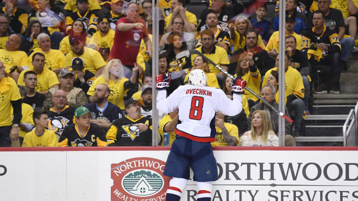 PITTSBURGH, PA – MAY 01: Washington Capitals Left Wing Alex Ovechkin (8) jumps into the glass after scoring the game winning goal during the third period. The Washington Capitals defeated the Pittsburgh Penguins 4-3 in Game Three of the Eastern Conference Second Round during the 2018 NHL Stanley Cup Playoffs on May 1, 2018, at PPG Paints Arena in Pittsburgh, PA. (Photo by Jeanine Leech/Icon Sportswire via Getty Images)