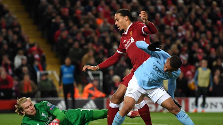 LIVERPOOL, ENGLAND - APRIL 04: Loris Karius of Liverpool collects the ball from the feet of Gabriel Jesus of Manchester City as he is challenged by Virgil van Dijk of Liverpool during the UEFA Champions League Quarter Final Leg One match between Liverpool and Manchester City at Anfield on April 4, 2018 in Liverpool, England. (Photo by Shaun Botterill/Getty Images)
