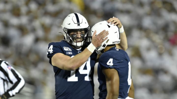 UNIVERSITY PARK, PA - OCTOBER 19: Penn State QB Sean Clifford (14) smiles and celebrates with RB Journey Brown (4) during the Michigan Wolverines vs. the Penn State Nittany Lions on October 19, 2019 at Beaver Stadium in University Park, PA. (Photo by Randy Litzinger/Icon Sportswire via Getty Images)