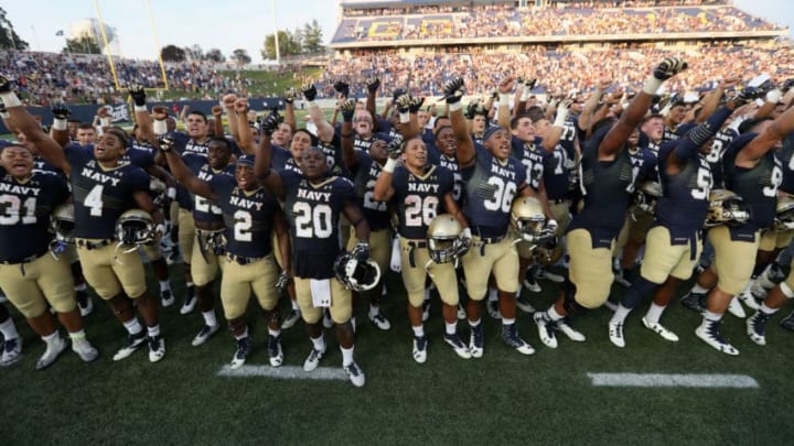 ANNAPOLIS, MD - SEPTEMBER 10: Members of the Navy Midshipmen celebrate their 28-24 win over the Connecticut Huskies at Navy-Marine Corps Memorial Stadium on September 10, 2016 in Annapolis, Maryland. (Photo by Rob Carr/Getty Images)