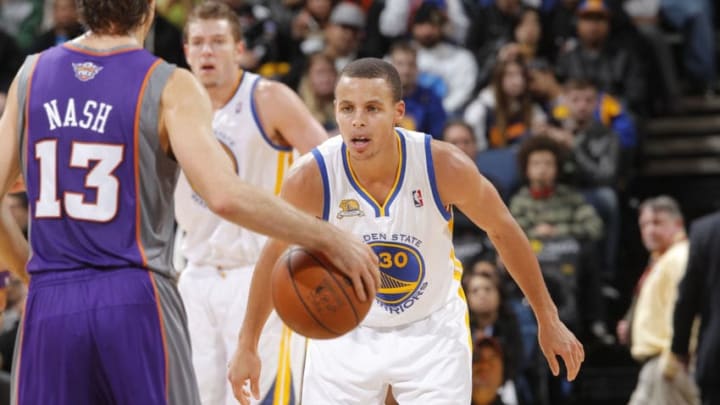 OAKLAND, CA - FEBRUARY 13: Stephen Curry #30 of the Golden State Warriors prepares to defend Steve Nash #13 of the Phoenix Suns on February 13, 2012 at Oracle Arena in Oakland, California. NOTE TO USER: User expressly acknowledges and agrees that, by downloading and or using this photograph, user is consenting to the terms and conditions of Getty Images License Agreement. Mandatory Copyright Notice: Copyright 2012 NBAE (Photo by Rocky Widner/NBAE via Getty Images)