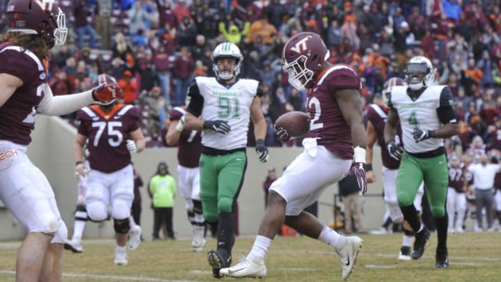 BLACKSBURG, VA - DECEMBER 1: Running back Steven Peoples #32 of the Virginia Tech Hokies scores a touchdown against the Marshall Thundering Herd in the first half at Lane Stadium on December 1, 2018 in Blacksburg, Virginia. (Photo by Michael Shroyer/Getty Images)