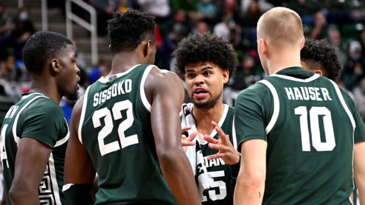 Nov 12, 2021; East Lansing, Michigan, USA; MichiganStateÕs Malik Hall(25 delivers a pep talk to teammates Gabe Brown(44) Mady Sissoko(22) and Joey Hauser(10) at Jack Breslin Student Events Center. Mandatory Credit: Dale Young-USA TODAY Sports