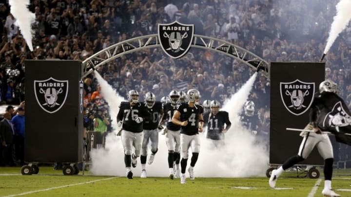 Nov 6, 2016; Oakland, CA, USA; Oakland Raiders quarterback Derek Carr (4) jogs onto the field before the start of the game against the Denver Broncos at Oakland Coliseum. The Raiders defeated the Broncos 30-20. Mandatory Credit: Cary Edmondson-USA TODAY Sports
