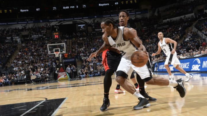 SAN ANTONIO, TX - MARCH 10: Kawhi Leonard #2 of the San Antonio Spurs drives to the basket against the Toronto Raptors on March 10, 2015 at the AT&T Center in San Antonio, Texas. NOTE TO USER: User expressly acknowledges and agrees that, by downloading and or using this Photograph, user is consenting to the terms and conditions of the Getty Images License Agreement. Mandatory Copyright Notice: Copyright 2015 NBAE (Photo by D. Clarke Evans/NBAE via Getty Images)