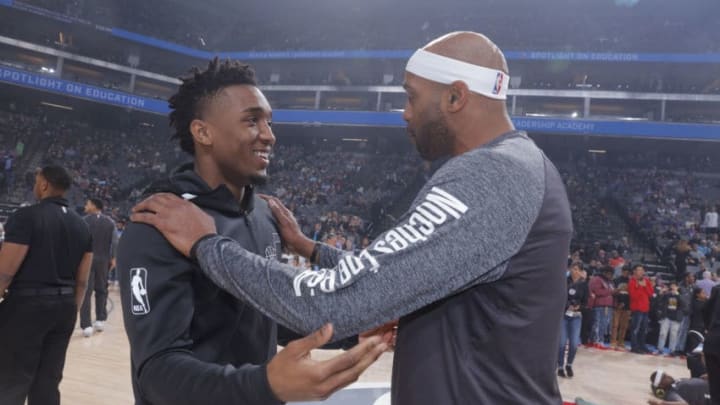SACRAMENTO, CA - MARCH 3: Donovan Mitchell #45 of the Utah Jazz speaks with Vince Carter #15 of the Sacramento Kings prior to the game on March 3, 2018 at Golden 1 Center in Sacramento, California. NOTE TO USER: User expressly acknowledges and agrees that, by downloading and or using this photograph, User is consenting to the terms and conditions of the Getty Images Agreement. Mandatory Copyright Notice: Copyright 2018 NBAE (Photo by Rocky Widner/NBAE via Getty Images)