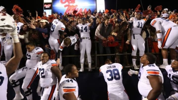 Nov 1, 2014; Oxford, MS, USA; Auburn Tigers players and fans celebrate at the end of the game against the Ole Miss Rebels at Vaught-Hemingway Stadium. Auburn defeated Ole Miss 35-31. Mandatory Credit: Nelson Chenault-USA TODAY Sports