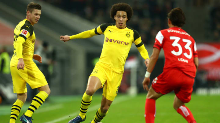 DUESSELDORF, GERMANY – DECEMBER 18: Axel Witsel of Borussia Dortmund takes on Takashi Usami of Fortuna Duesseldorf during the Bundesliga match between Fortuna Duesseldorf and Borussia Dortmund at Esprit-Arena on December 18, 2018 in Duesseldorf, Germany. (Photo by Maja Hitij/Bongarts/Getty Images)